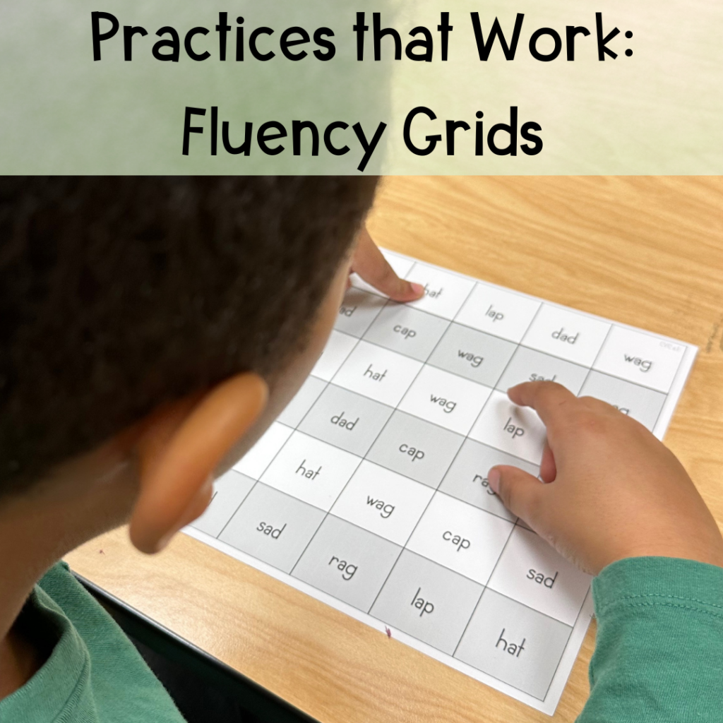 A young boy reading a fluency grid.